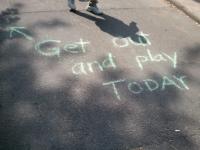 Sidewalk chalk encouraging passers to get involved
